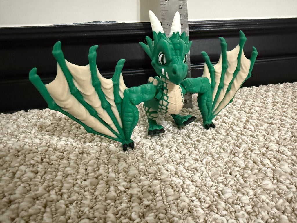 No, it's not a dragon, its a Wyvern. And it is 3D Printed.